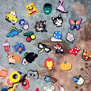 65 random croc charms!